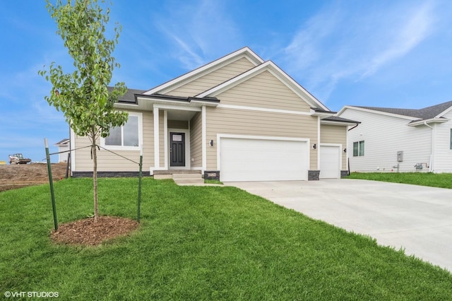 6724 Bright St, Johnston, IA 50131 - ranch-style house featuring a front lawn, an attached garage, driveway, and roof mounted solar panels