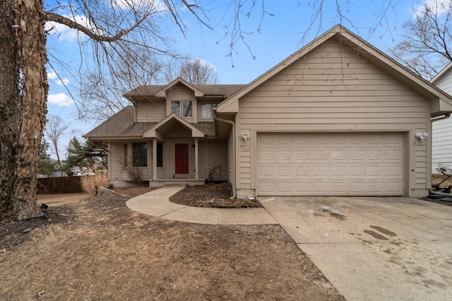 view of front facade with a garage, roof with shingles, and concrete driveway