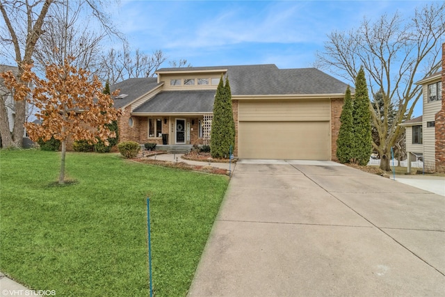 view of front of home featuring a garage and a front yard