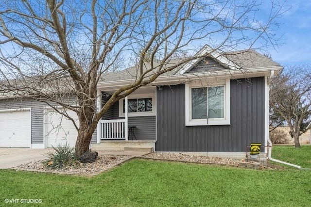 view of front of property with a garage, a porch, and a front lawn