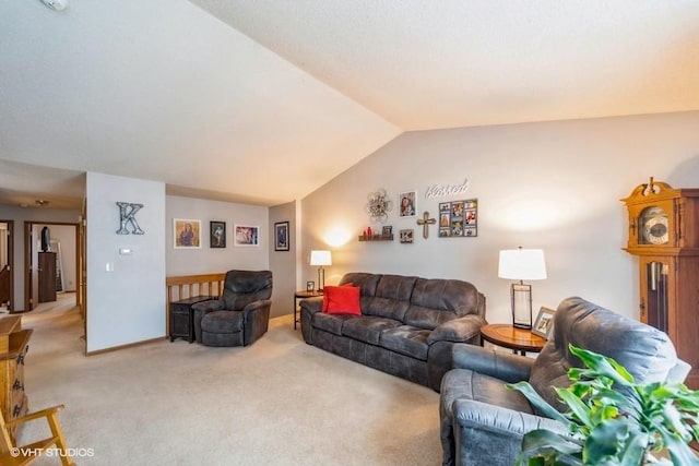 carpeted living room with vaulted ceiling