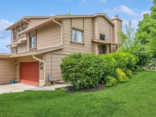 exterior space with a garage and a front yard