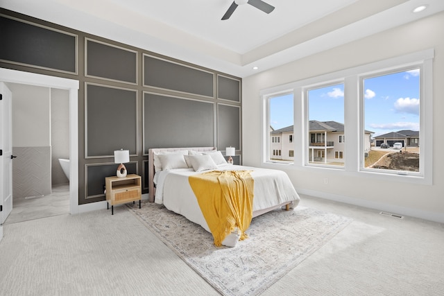 bedroom featuring carpet floors, recessed lighting, visible vents, a decorative wall, and a ceiling fan