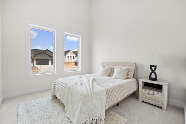 bedroom with carpet and baseboards