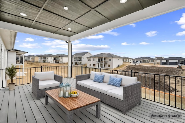 wooden deck with a residential view and an outdoor living space