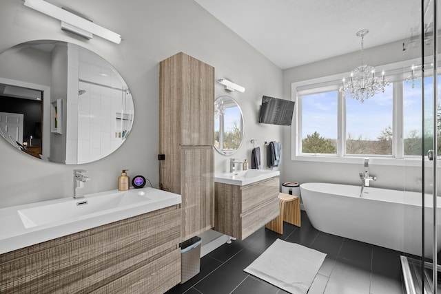 full bathroom featuring tile patterned floors, a soaking tub, and vanity