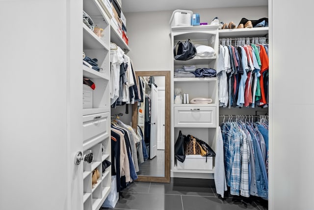 spacious closet with tile patterned floors