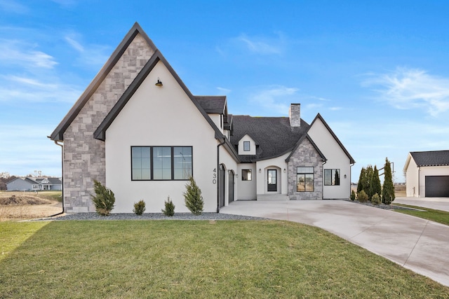 view of front of house featuring a front lawn, stone siding, and stucco siding