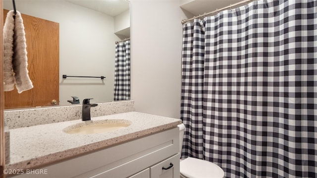 bathroom with vanity and toilet