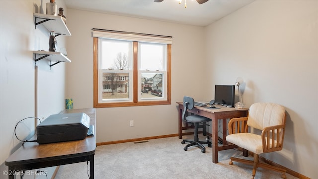 office area with ceiling fan and light carpet