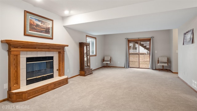 unfurnished living room featuring light colored carpet and a fireplace