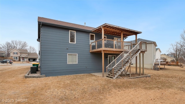 back of house featuring a wooden deck