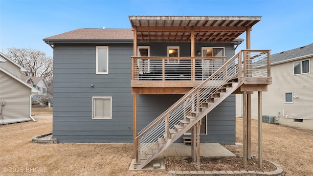 back of property featuring central air condition unit