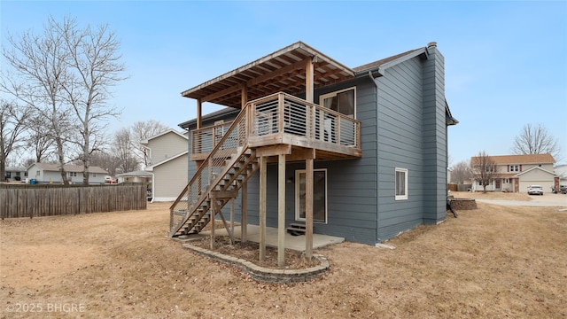 back of property featuring a deck