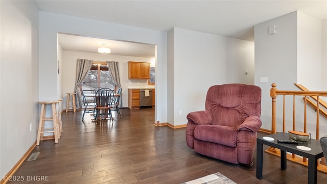 living area with dark hardwood / wood-style floors