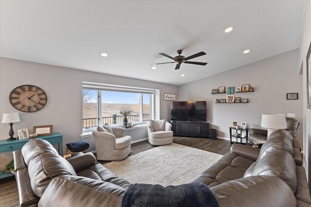 living room with dark hardwood / wood-style flooring, vaulted ceiling, and ceiling fan