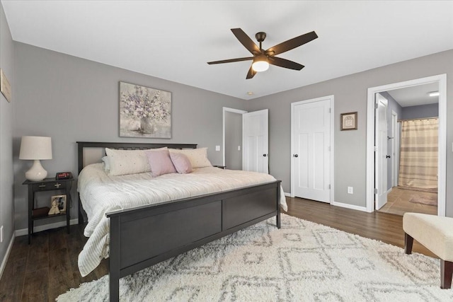 bedroom featuring hardwood / wood-style flooring, ceiling fan, and ensuite bathroom