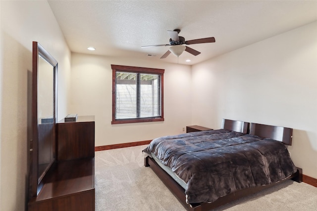 bedroom with light colored carpet and ceiling fan