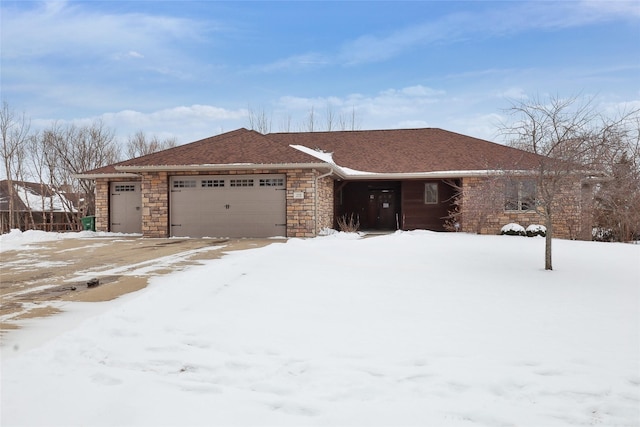 view of front of home with stone siding, roof with shingles, and an attached garage