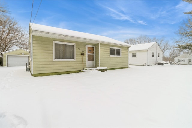 view of front facade with a garage and an outdoor structure