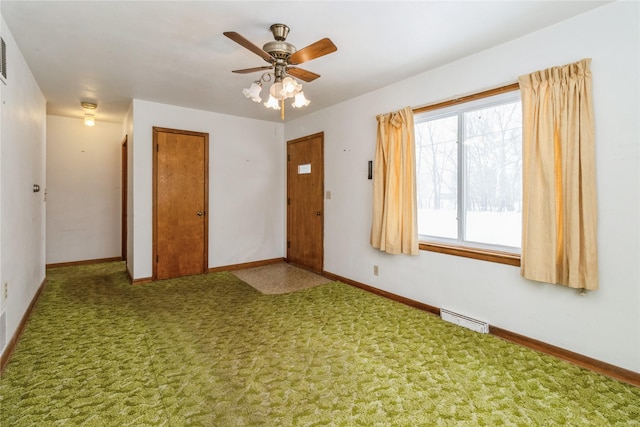 carpeted spare room with ceiling fan