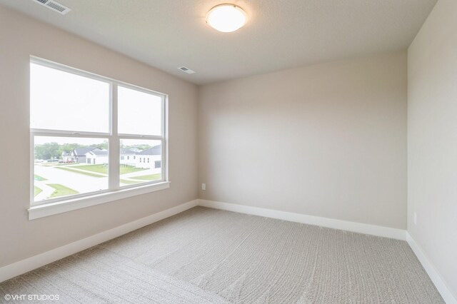15019 Springbrook Trl, Urbandale, IA 50323 - spare room featuring carpet floors and baseboards