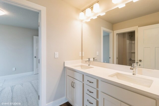 15019 Springbrook Trl, Urbandale, IA 50323 - bathroom with double vanity and a shower