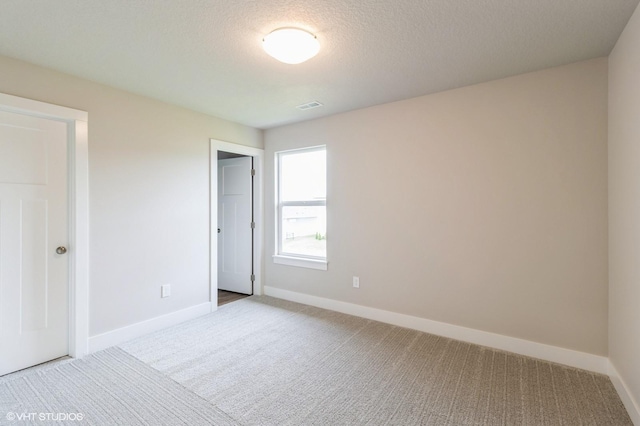 15019 Springbrook Trl, Urbandale, IA 50323 - unfurnished bedroom featuring carpet flooring and a textured ceiling