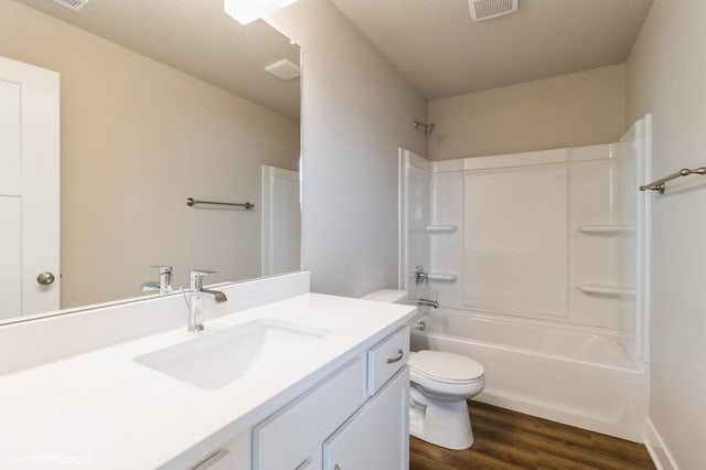 15019 Springbrook Trl, Urbandale, IA 50323 - bathroom featuring vanity, wood finished floors, and shower / bathtub combination