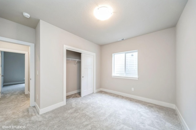 15015 Springbrook Trl, Urbandale, IA 50323 - unfurnished bedroom with light colored carpet and a closet