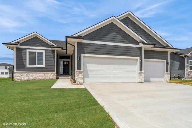 15015 Springbrook Trl, Urbandale, IA 50323 - craftsman-style house featuring stone siding, an attached garage, a front yard, and concrete driveway