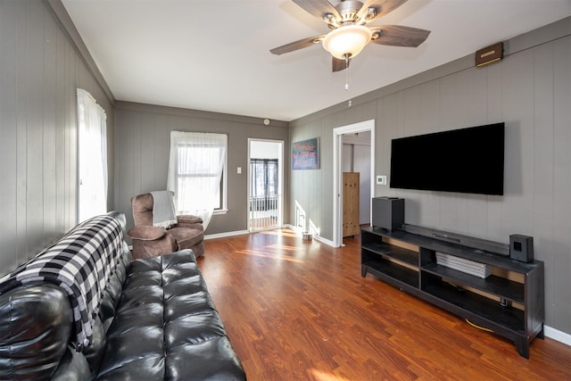 living room with hardwood / wood-style flooring and ceiling fan