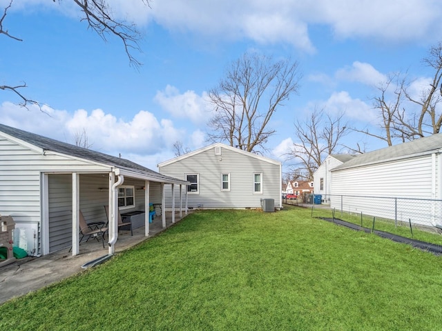 view of yard with a patio and central AC unit