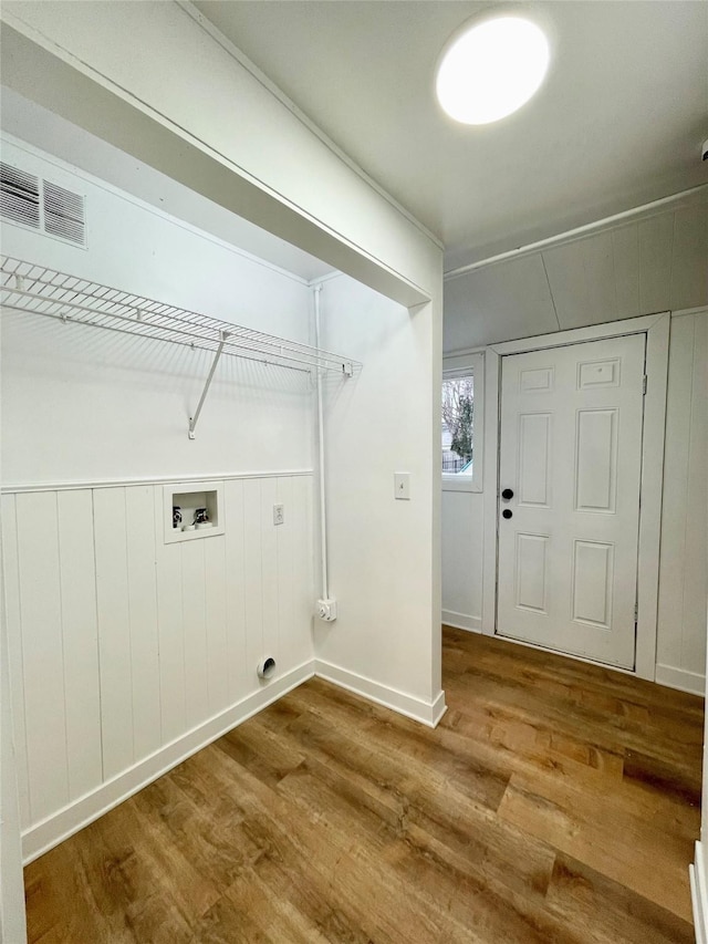 clothes washing area featuring washer hookup and wood-type flooring