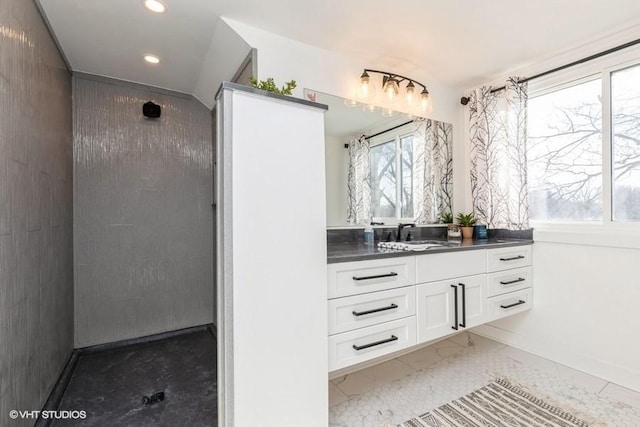 bathroom with a wealth of natural light, vanity, and recessed lighting