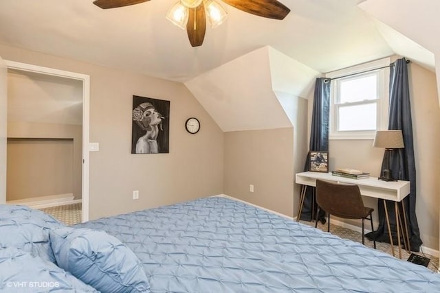 bedroom with lofted ceiling, carpet flooring, and baseboards