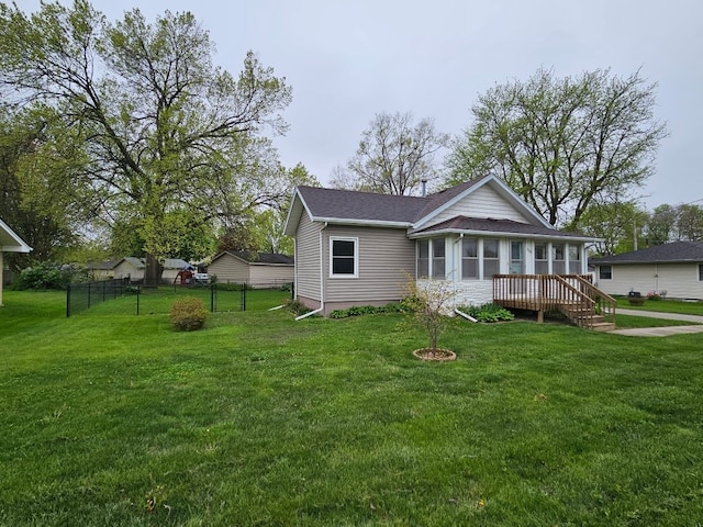 exterior space with fence and a yard