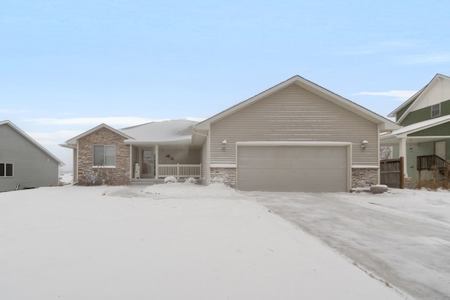 ranch-style home with a garage and a porch