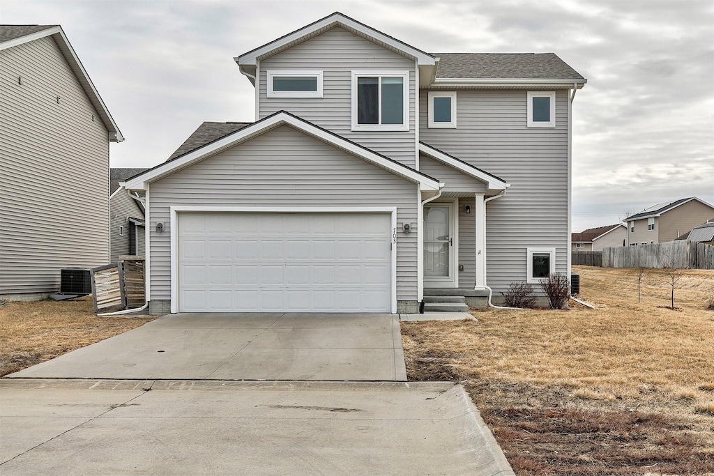 703 Cherry St NW, Bondurant, IA 50035 - view of front of home with a garage