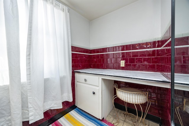 2711 Westover Blvd, Des Moines, IA 50322 - bathroom with tile walls and a wainscoted wall