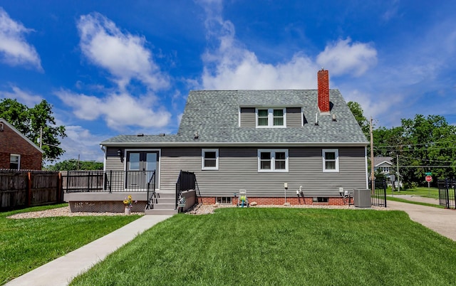 2711 Westover Blvd, Des Moines, IA 50322 - back of house featuring a deck, a chimney, and roof with shingles