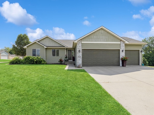 ranch-style home with a garage and a front yard