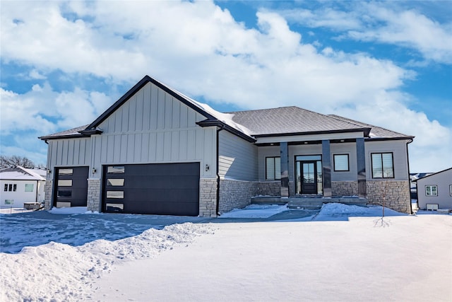 view of front facade with a garage and covered porch