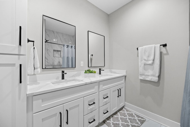 bathroom with vanity and a shower