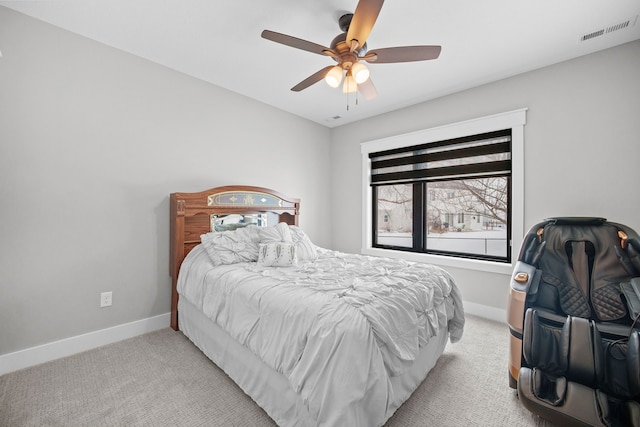 bedroom with light colored carpet and ceiling fan