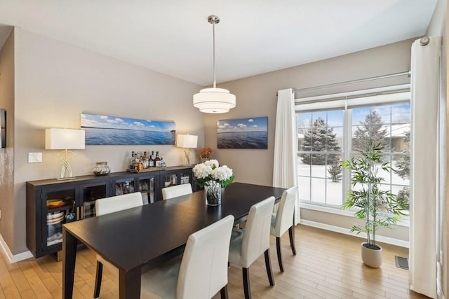 dining area with light wood-type flooring