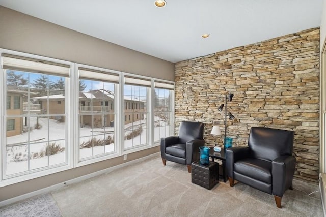 sitting room with light colored carpet and a wealth of natural light