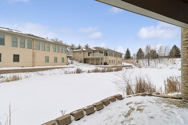 view of yard covered in snow