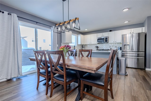 dining room featuring light hardwood / wood-style flooring