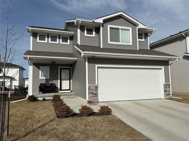 view of front of house featuring a garage, fence, covered porch, and roof with shingles